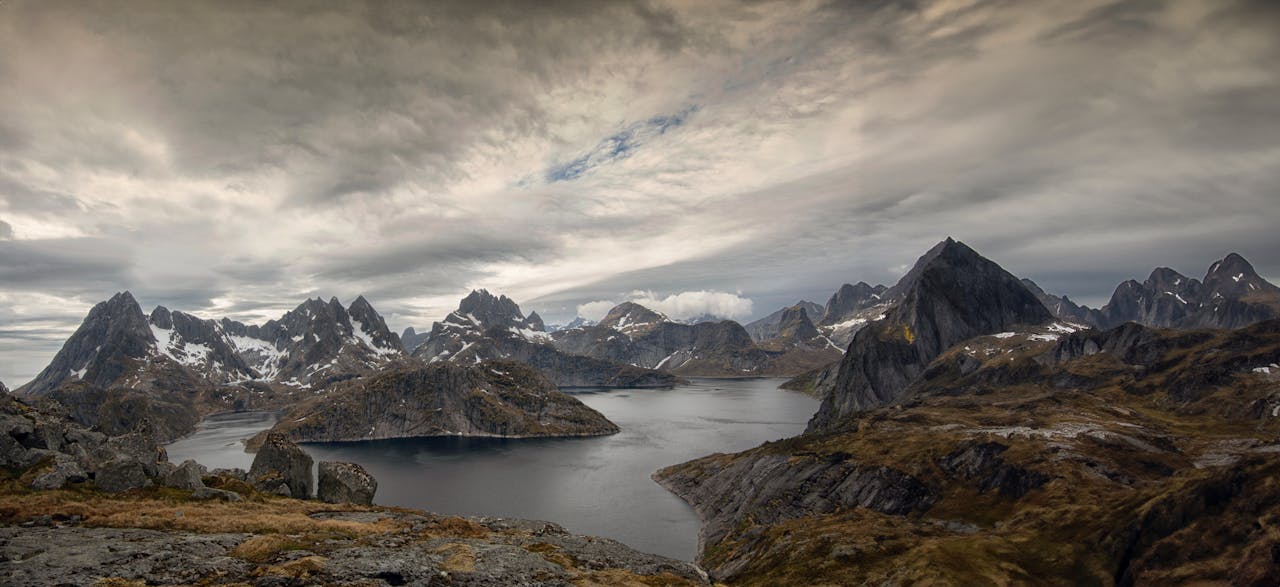 Stunning panorama of Lofoten Islands rugged mountains and pristine fjords.